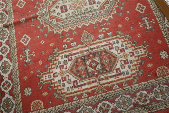 A Persian style red ground rug, 5ft 8in. x 4ft 5in.